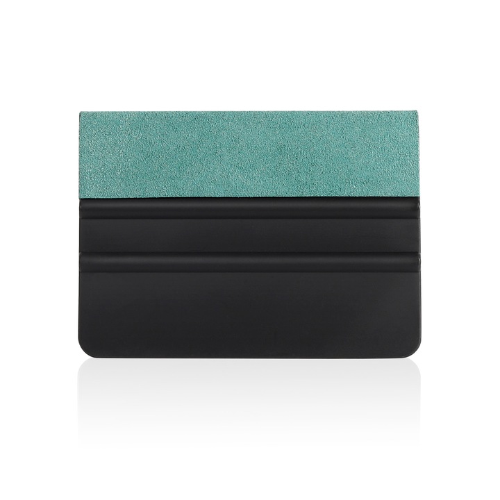 Autófólia felhelyezéséhez használt lehúzó filccel, zöld