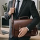 Geanta Business din Piele Ecologica Premium, Tip Servieta, cu Doua Catarame Metalice, Compartiment Laptop, Curea Reglabila, Ideala pentru Office si Calatorii, 26 cm x 37 cm x 10 cm, Maro Inchis, PriStyle®