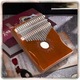 Kalimba 17 clape, Pixel, din lemn, cu 2 orificii Vibrato, culoare mahon, 18x13x3,5cm