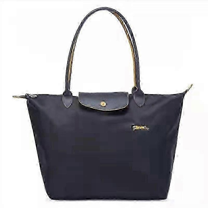 Dombornyomott bőr és vízálló nylon táska, szürke, a képnek megfelelő méretek, összecsukható kialakítás.