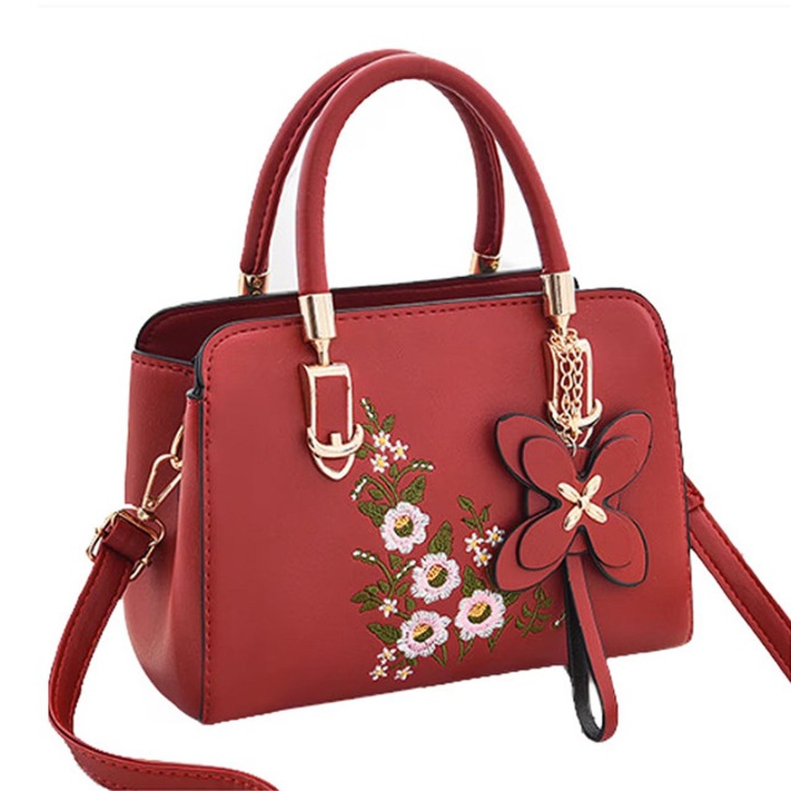 Női táska, medállal és hímzett virággal, vállpánttal és két fix fogantyúval, több rekesszel, ökológiai bőr, piros