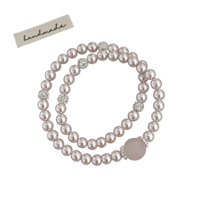 Bratara cu doua randuri de perle pentru femei, in nuanta roz pal, cu cristale roz naturale si pietre zirconiu. Design de inspiratie franceza, material elegant si elastic