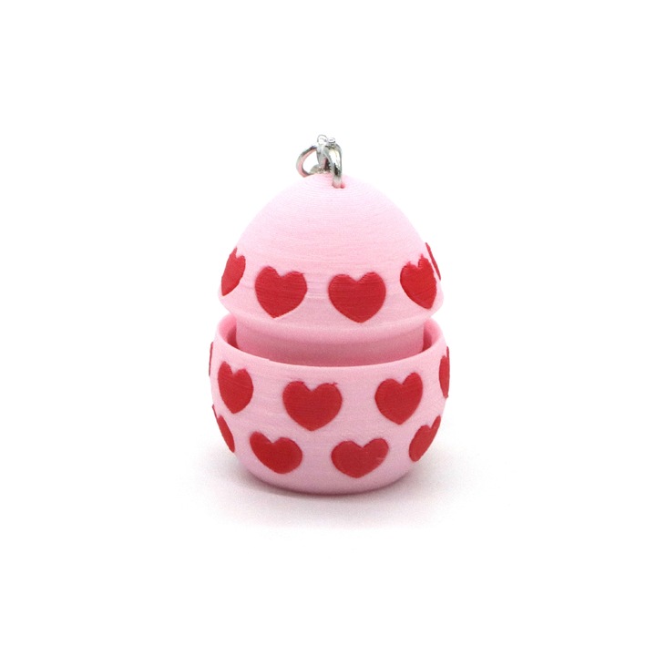 Nyomógombos dekompressziós kulcstartó, szív alakú tojás design, rózsaszín