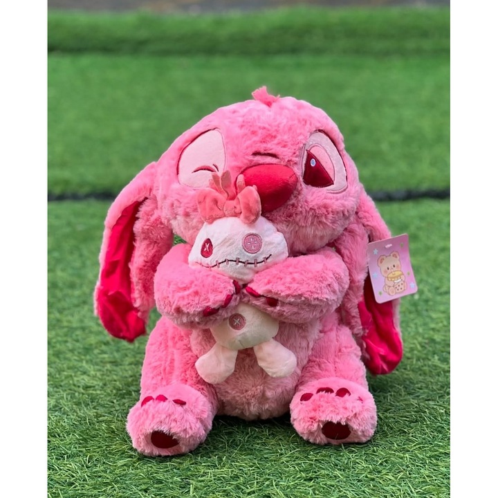 Jucarie de Plus Tip Stitch Roz, 35 cm, Moale si Pufoasa, cu Accesoriu Plus Inclus