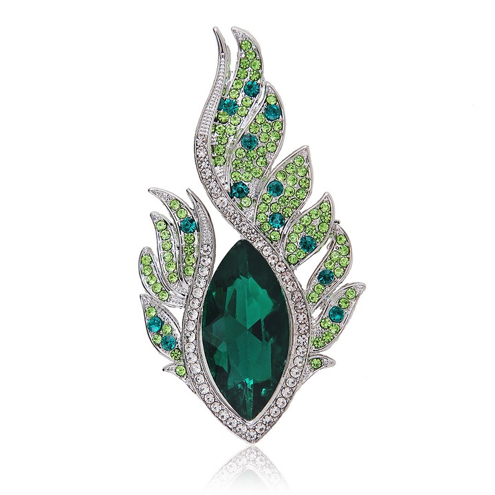 Brosa eleganta in forma de flacara, cu cristal verde si zirconii