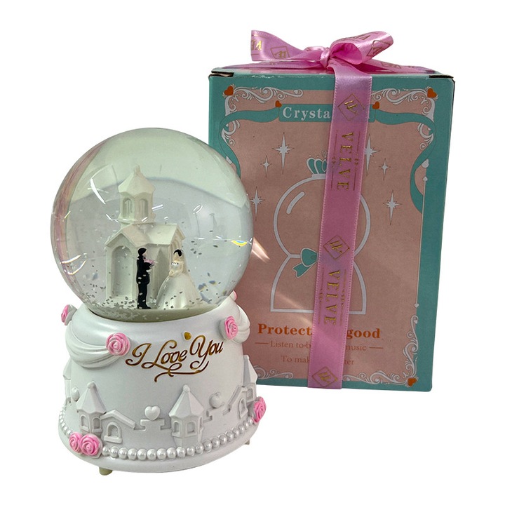 Glob muzical din sticla cu miri, bisericuta si mesaj „I Love You”, cu suport decorativ din rasina