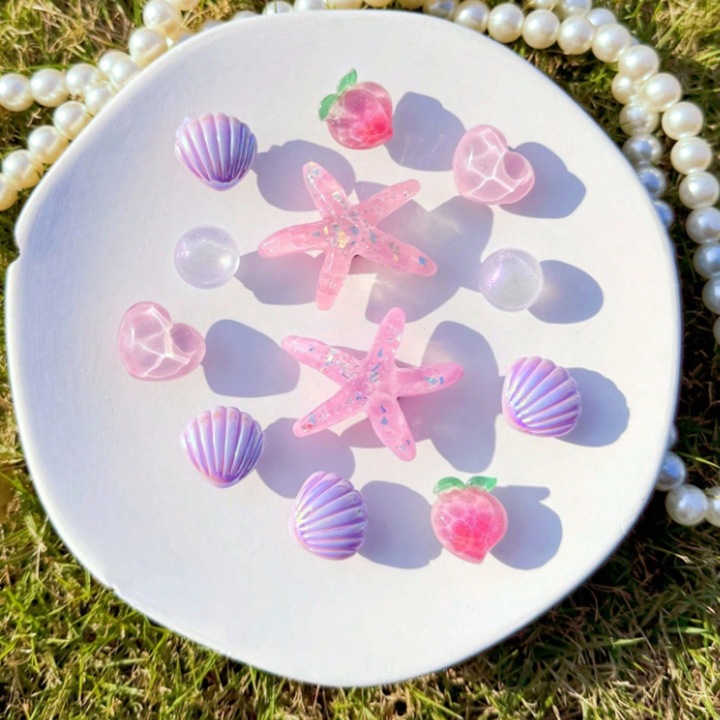 Set 12 accesorii saboti, Crocs, tip Jibbitz, Vis de Mare, Roz Sidefat