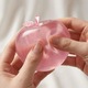 Jucarie antistres squishy, mar gel transparent, textura moale si elastica, realist si lucios, roz
