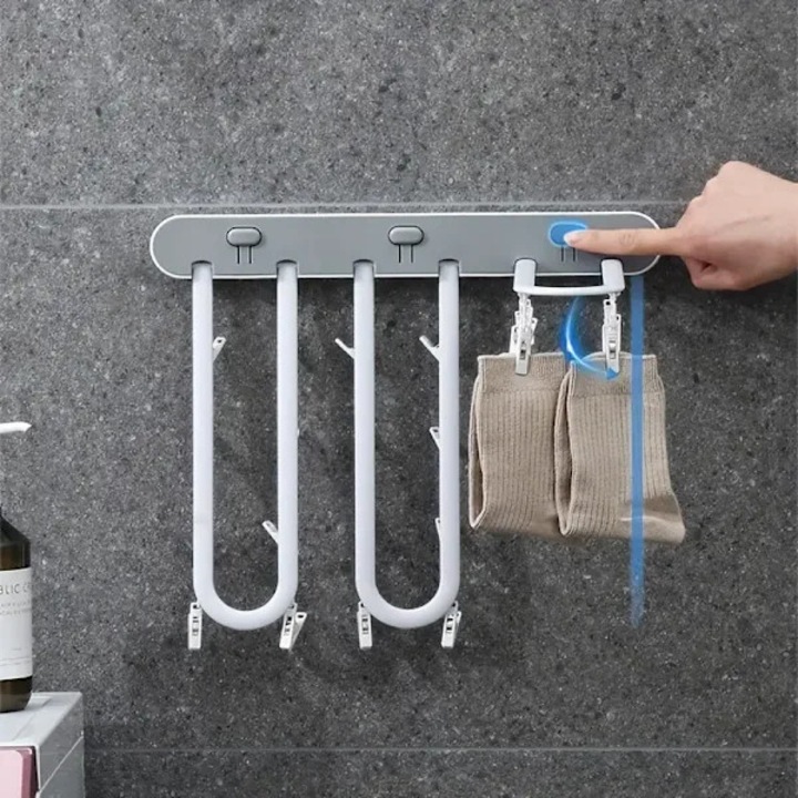 Uscator rufe montat pe perete, suport pliabil pentru uscat rufe, fixare fara gaurari cu banda adeziva, din ABS durabil, cu cleme integrate, alb/gri, 1 buc
