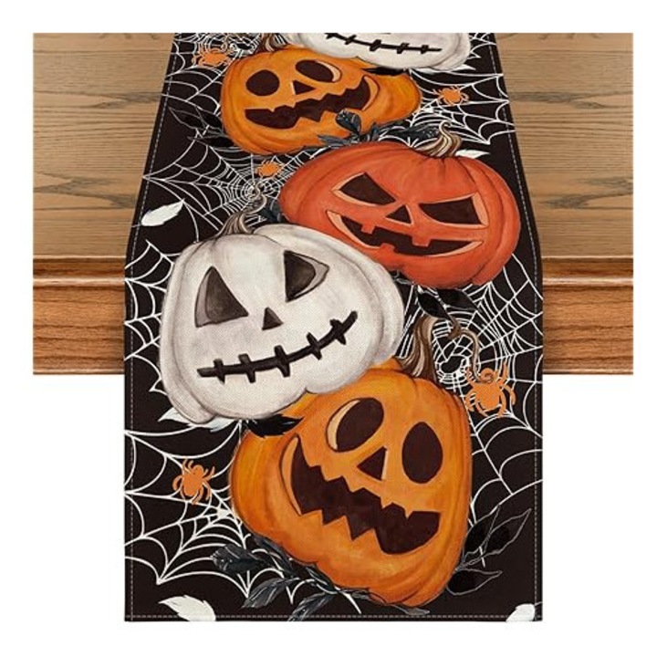 Fekete Halloween asztalterítő 40x240cm világító dekorációkkal és tökökkel