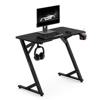 Birou gaming SENSE7 VAMO, 100x50 cm, blat MDF invelit in textura de fibra de carbon, capacitate de sarcina 80 kg, suport pentru casti, suport pentru cana, negru