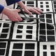 Előre vágott méteráru 150x300 cm fekete/geometriai