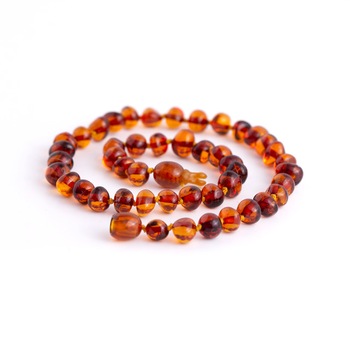 Colier chihlimbar copii, pentru ameliorarea durerilor provocate de eruptia dentara, culoare maro-coniac, 32 cm Colier chihlimbar copii, pentru ameliorarea durerilor provocate de eruptia dentara, culoare maro-coniac, 32 cm