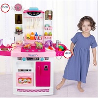 bucatarie multifunctionala idl candy pink 95 cm inaltime efecte luminoase si sonore dotata cu accesorii simbolice aragaz frigider cuptor vesela produse alimentare care sporesc dezvoltarea abilitatilor de gospodar a orcarui copil roz imagen 33_0_
0