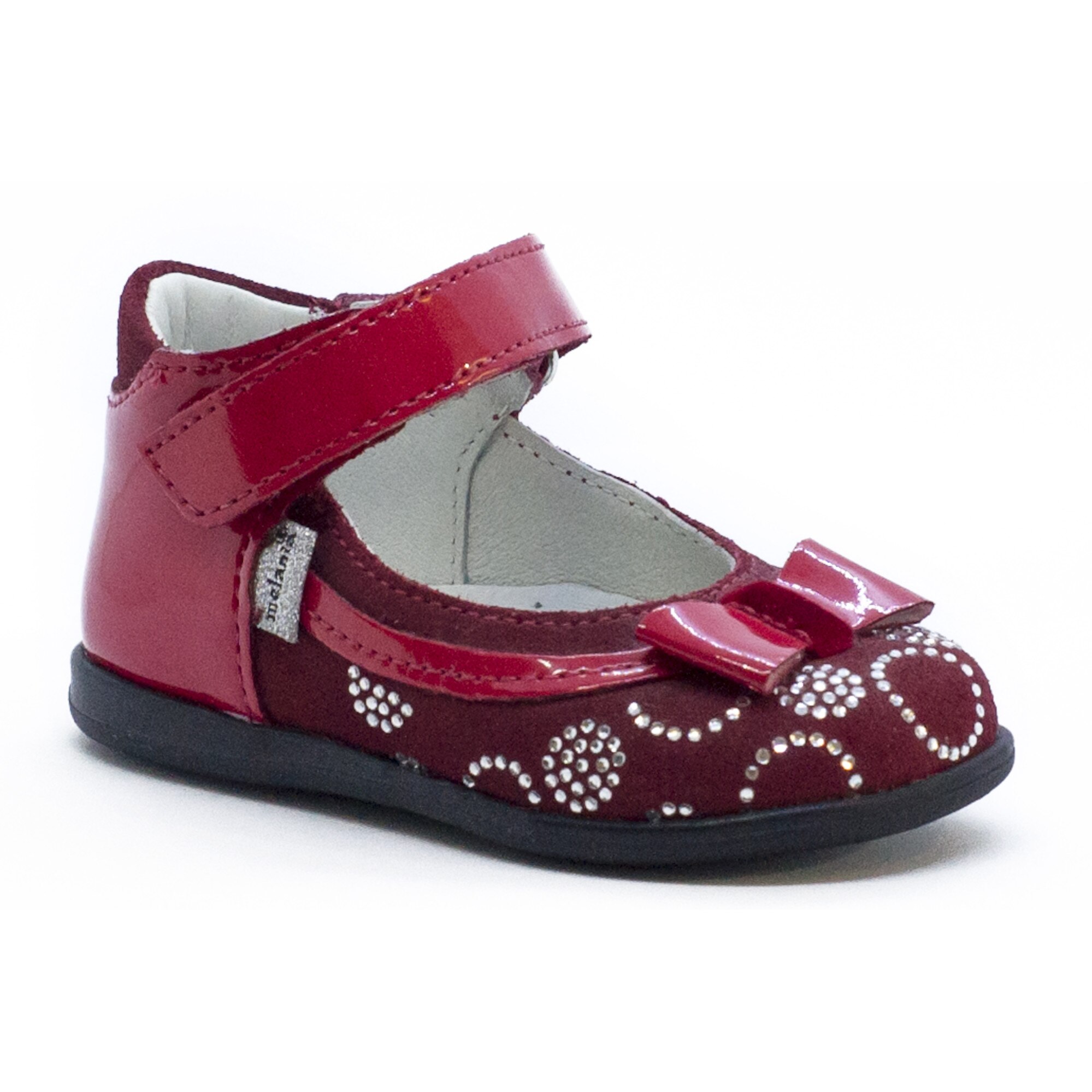 Pantofi rosii cu cerculete, Melania