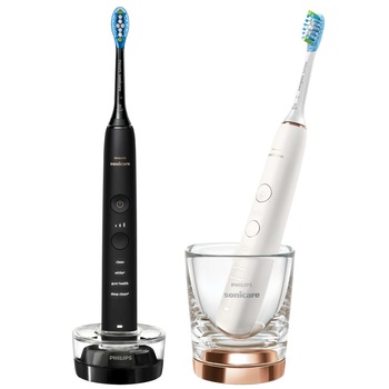 Set 2 periute electrice sonice Philips Sonicare DiamondClean 9000 HX9914/57, functie BrushSync, 4 moduri de periere, 3 nivele de intensitate, senzor de presiune, 2 capete de periere, 2 baze cu rol de incarcare, Negru / Rose gold Set 2 periute electrice sonice Philips Sonicare DiamondClean 9000 HX9914/57, functie BrushSync, 4 moduri de periere, 3 nivele de intensitate, senzor de presiune, 2 capete de periere, 2 baze cu rol de incarcare, Negru / Rose gold