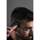 Aparat de tuns parul Rowenta Advancer TN5221F4, autonomie 120min, functie incarcare rapida, 3 piepteni, 45 de lungimi de taiere, lame cu tehnologie de auto-ascutire, negru/rosu