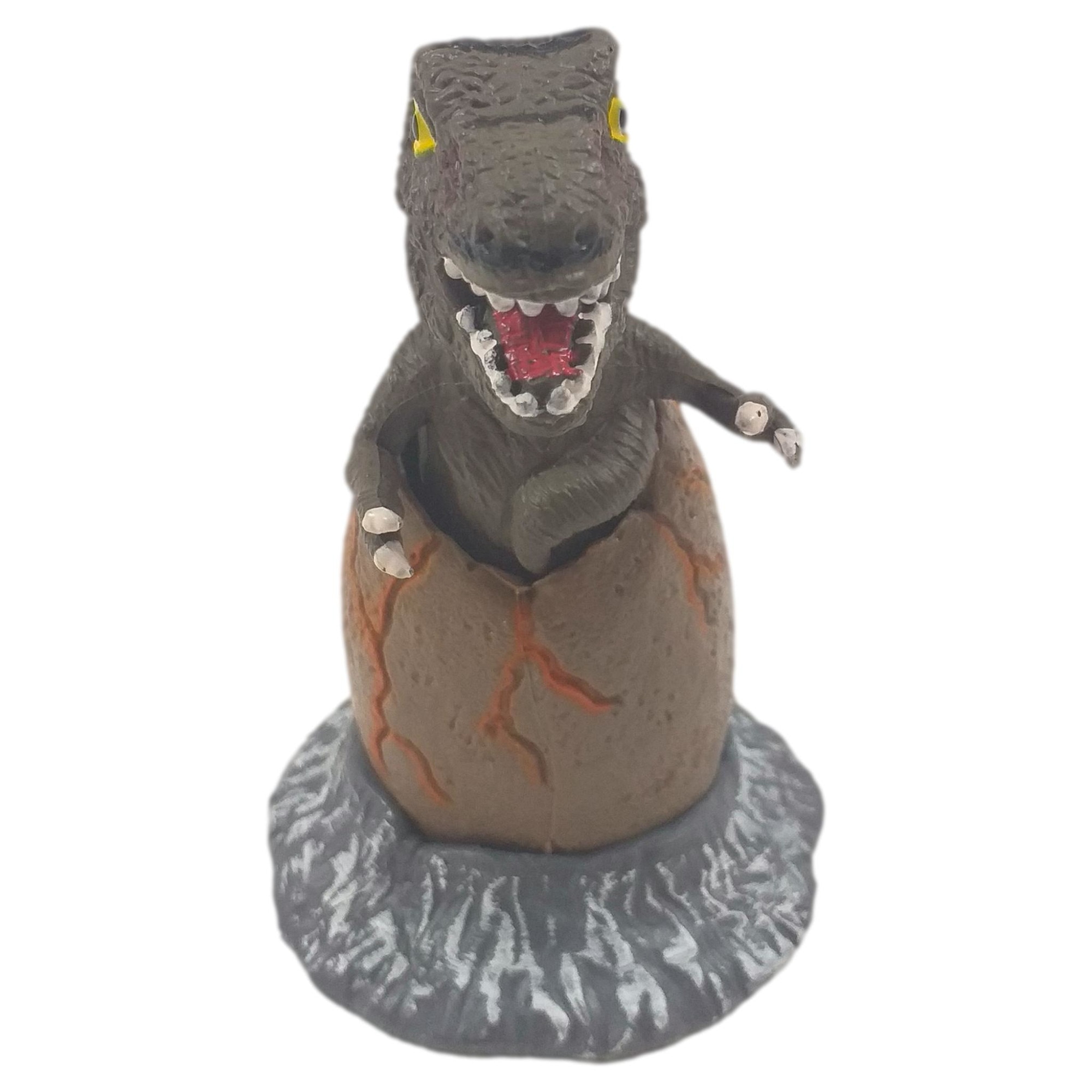 Figurina pui de Dinozaur fixat in ou, Maro/Alb, 9.5 X 6.5