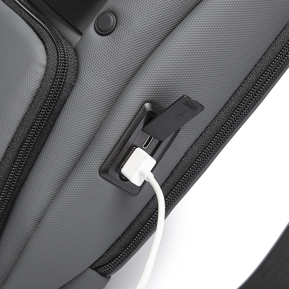Rucsac crossbody/de umar casual, impermeabil, cu port de incarcare USB si compartiment casti, Bange, Gri
