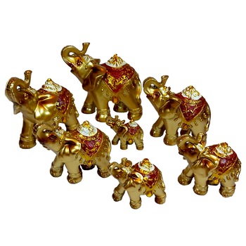 Set 7 Statuete ArtDeco Harmony Elefanti aurii din polirasina cu sa rosu cu alb Set 7 Statuete ArtDeco Harmony Elefanti aurii din polirasina cu sa rosu cu alb