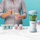 Blender Nutribullet Baby 200 W 0C22300026, 1 viteza, vas 0.9l, cupa mica 0.295l, 6 recipiente depozitare cu capac, tava silicon, Alb