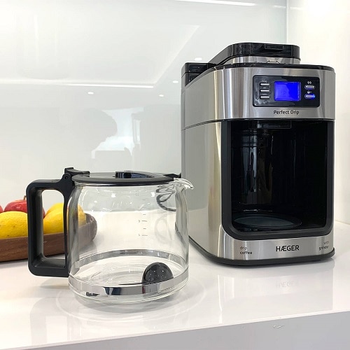 Cafetiera 2 in 1 HAEGER PERFECT DRIP CM-10B.010A, 1050 W, 1.25 L, 10 Cesti, rasnita cafea incorporate 60 gm, oprire automata, functie keep warm, timer, afisaj LCD, argintiu/negru