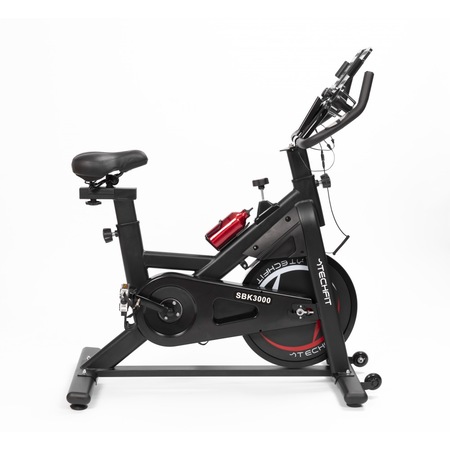 Bicicleta spinning magnetica TECHFIT SBK3000, Sistem inertie volanta 18 Kg, Greutate utilizator 120 Kg, Bluetooth, FITSHOW, Suport telefon/tableta, Suport sticla, Roti transport