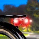 Dunlop Kerékpár hátső lámpa K-mark 3xLED 2xAAA elemet tartalmaz ABS 110x47x35mm, 70g TOC