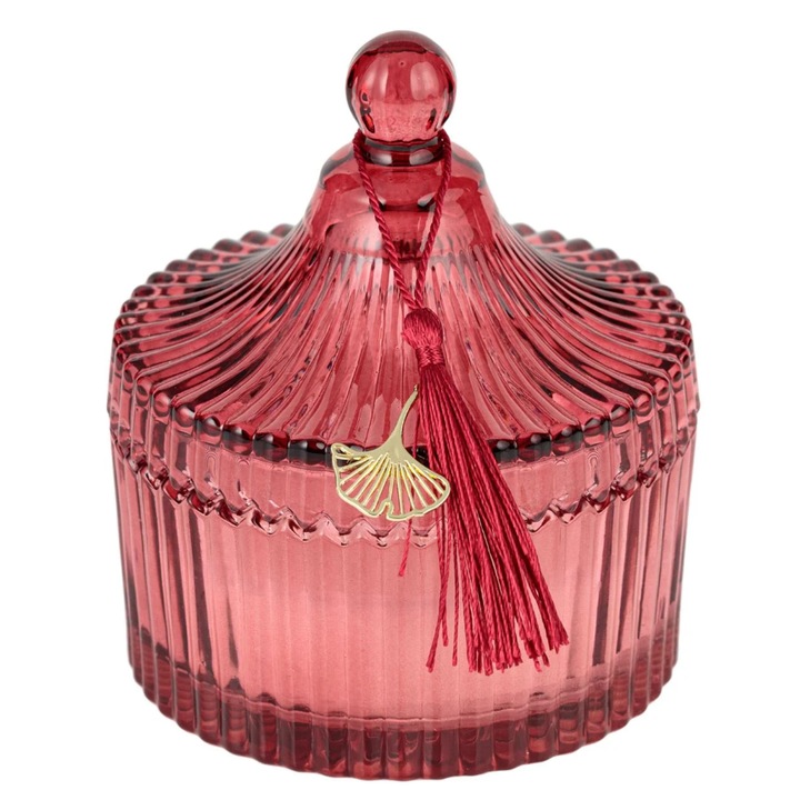 Бяла декоративна свещ в свещник от червено стъкло с релефен раиран дизайн и капак с кръгла дръжка, червени пискюли и златна декорация 15см