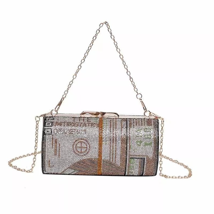 Tessero női csatos válltáska, henger alakú, strasszokkal díszített, dollár bankjegy mintával, arany szín