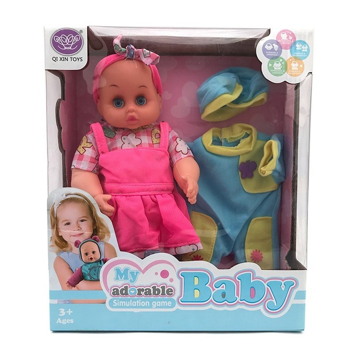 Műanyag babakészlet elemmel és váltóruhával, 25x29 cm