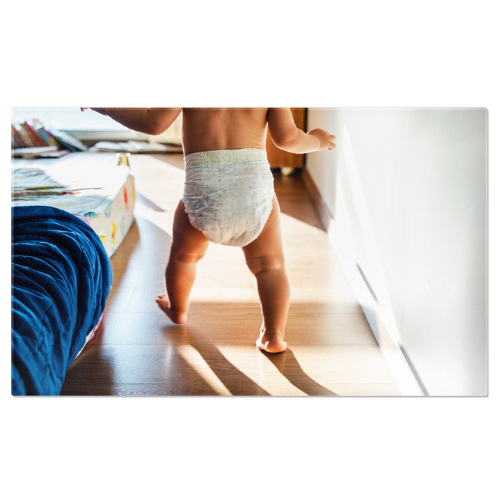 Tablou Canvas - Primii pasi: Bebelus curios, pasi goi si momente adorabile din copilarie 40x25CM