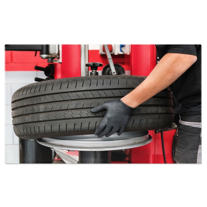 Картина на платно - Авто работилница: механик смяна на гума на автомобил 90x60CM