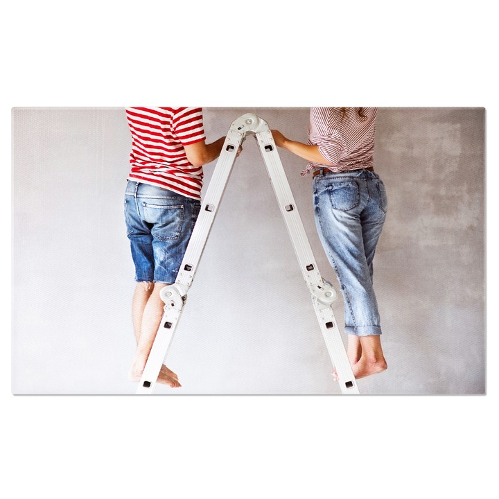 Tablou Canvas: Arta Renovarii - Cuplu Decorand Casa cu Pas 90x60CM