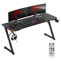 Birou Gaming Huzaro Hero 4.8 RGB LED, Blat 160x60 cm, Iluminare LED, Telecomanda, Mousepad XXL inclus, Suport Casti si Cana, Structura Solida, Finisaj Carbon, Orificii Cabluri, Birou PC pentru Jocuri si Munca, Stabilitate Ridicata, Negru