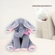 NEXTLY plüssjáték, Peek a Boo elefánt, énekel, Cucu Bau-val játszik és fülekkel takarja az arcot, 33 x 16 cm, szürkés-rózsaszín