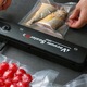 Aparat de vidat Vacuum Sealer 90W negru, 10 pungi incluse, dimensiuni 345x65x40 mm, sigilare alimente uscate si umede, conservare prospetime, pompa puternica, economisire spatiu frigider, functionare automata, aparat compact bucatarie moderna