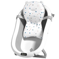Cadita Bebe GALAXIA®, cu suport si termometru, pliabila, include o perna de siguranta detasabila, protectie anti-alunecare, sarcina maxima 46 kg, gri