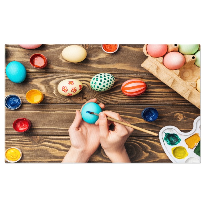 Tablou Canvas traditii si Creativitate Femeia Pictand Oua de Paste Pe Un Fundal de Lemn O Celebrare a Sarbatorilor Pascale Cu Stil si Arta 40x25CM