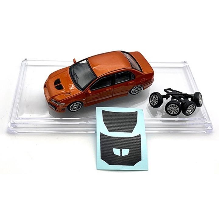 Macheta Mitsubishi Lancer Evolution VII custome orange cu roti de schimb si vitrina plexiglass - 1/64 BM Creations Junior