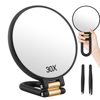 Oglinda Cosmetica pentru Machiaj, SINBINTA, Cu 2 penseta pentru sprancene, 2 Fete, Marire 1x 30x, Rotire 360º, Usor de Transportat, Pliabila, Design ergonomic, pentru calatorie, iesire in oras, ABS/Sticla, 13.9x24cm, Negru