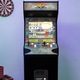Конзола с 14 игри ARCADE1UP, Street Fighter™ II Deluxe, Вертикална, H 155 cm, 17 инчов цветен дисплей, Marquee осветление, външен високоговорител, регулируема сила на звука, защита срещу преобръщане, аркадни контроли с истинско усещане, многоцветни