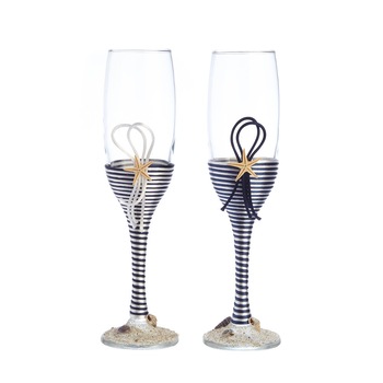 Set pahare sampanie nunta miri / nasi tema marina decorate cu snur satinat alb si bleumarin, stele de mare si melci Set pahare sampanie nunta miri / nasi tema marina decorate cu snur satinat alb si bleumarin, stele de mare si melci