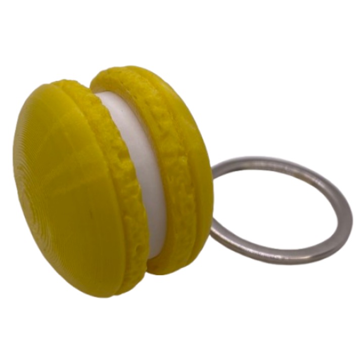 Breloc Macaron Clicky – Accesoriu Original si Creativ, Perfect pentru Cadouri si Colectionari Galben