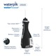 Irigator bucal Waterpik Profesional WP-582, portabil, 4 capete curatare, 3 trepte presiune, incarcare USB magnetica, negru