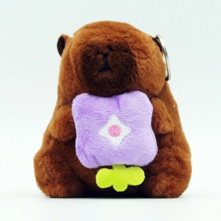 Jucarie Breloc din Plus Tip Capybara, pentru Copii +3 Ani, Lungime 11 cm, Culoare Maro cu Floare Mov ABYZ™, Accesoriu Dragalas si Distractiv