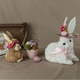 Великденска украса, изработена от трева, фигура на бяло зайче с розова шапка и цветя, 20x24x30см