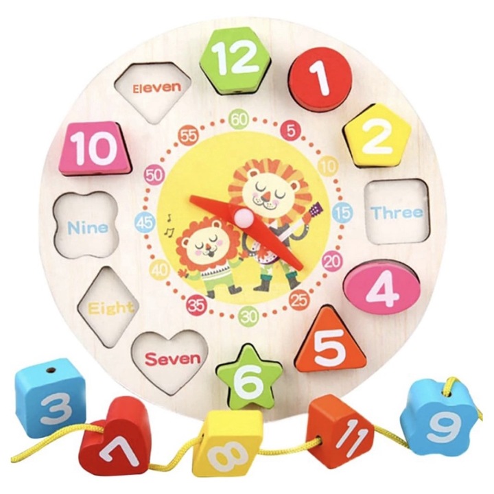 Fából készült óra geometriai formákkal, betéttel és füzérrel