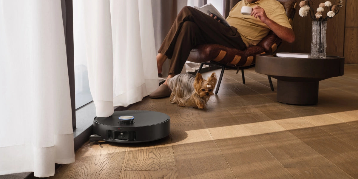 A person sitting in a chair with a dog on the floor AI-generated content may be incorrect.