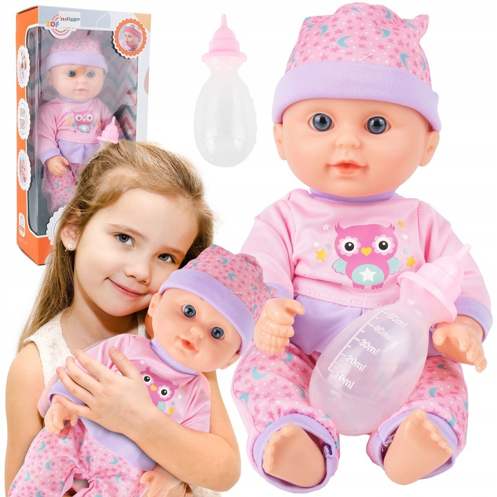 Бебешка кукла Loona Baby за деца, със звуци и бутилка, смее се, плаче, гука, пикае и говори, мека гумена глава, тяло, ръце и крака от устойчива пластмаса, свалящи се дрехи, Indiggo, височина 31 см, 3 години+, бонбонено розово